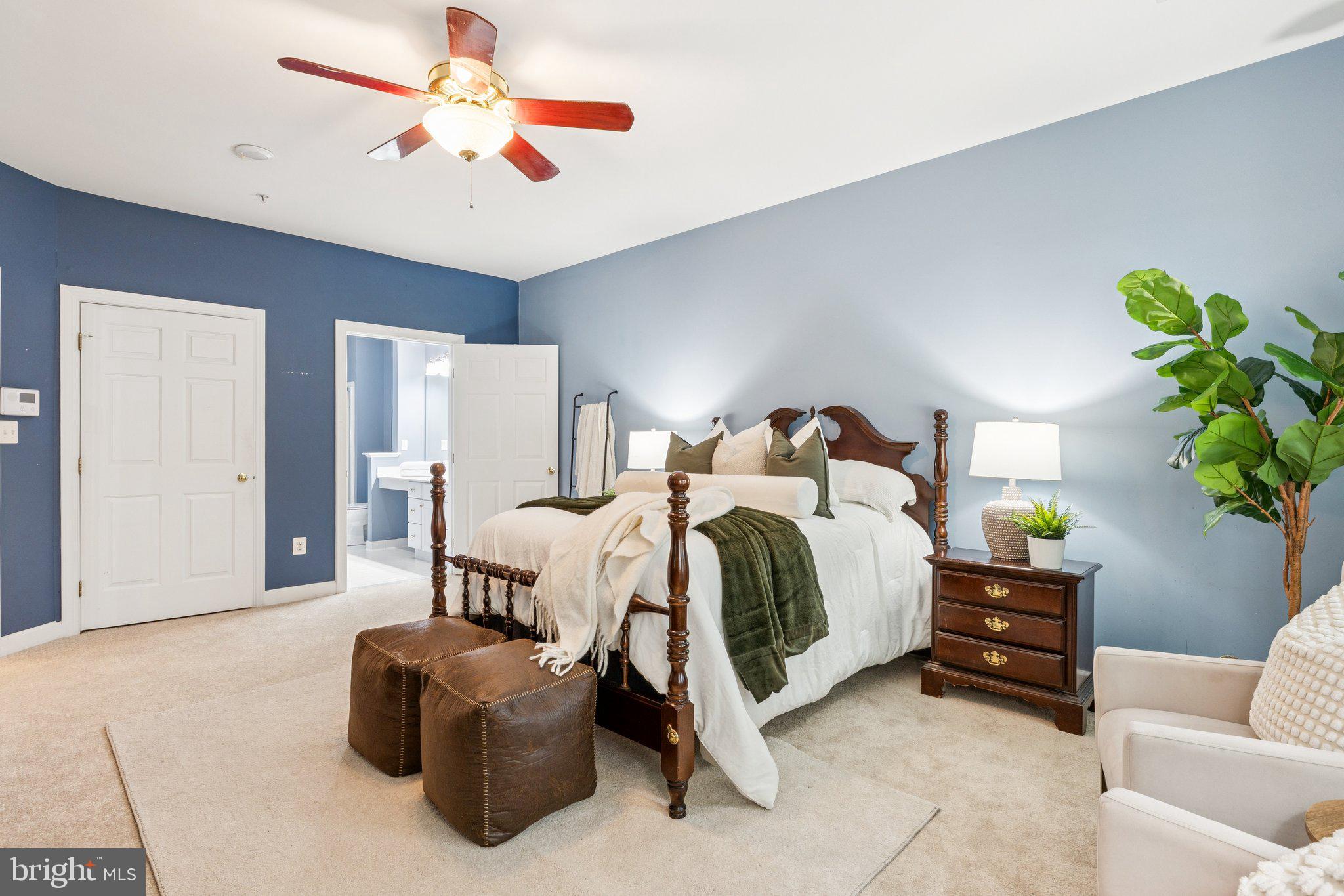 381 Colony Point Place Edgewater, MD 21037 - Photo 21 of 37 a bedroom with a bed and a couch