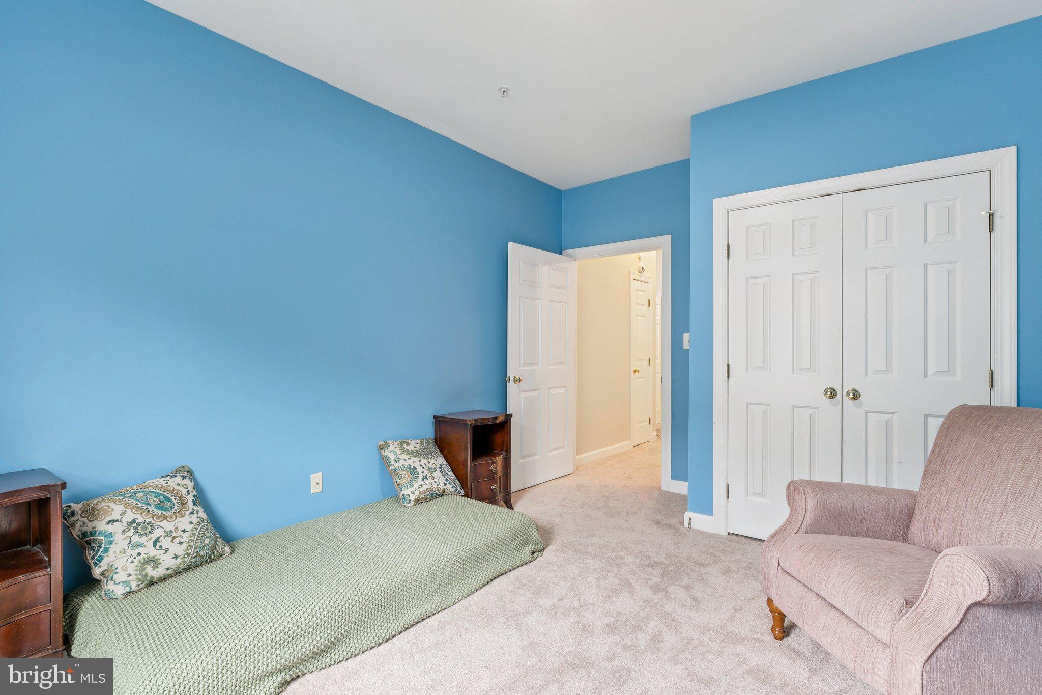 381 Colony Point Place Edgewater, MD 21037 - Photo 25 of 37 a bedroom with a bed and a couch