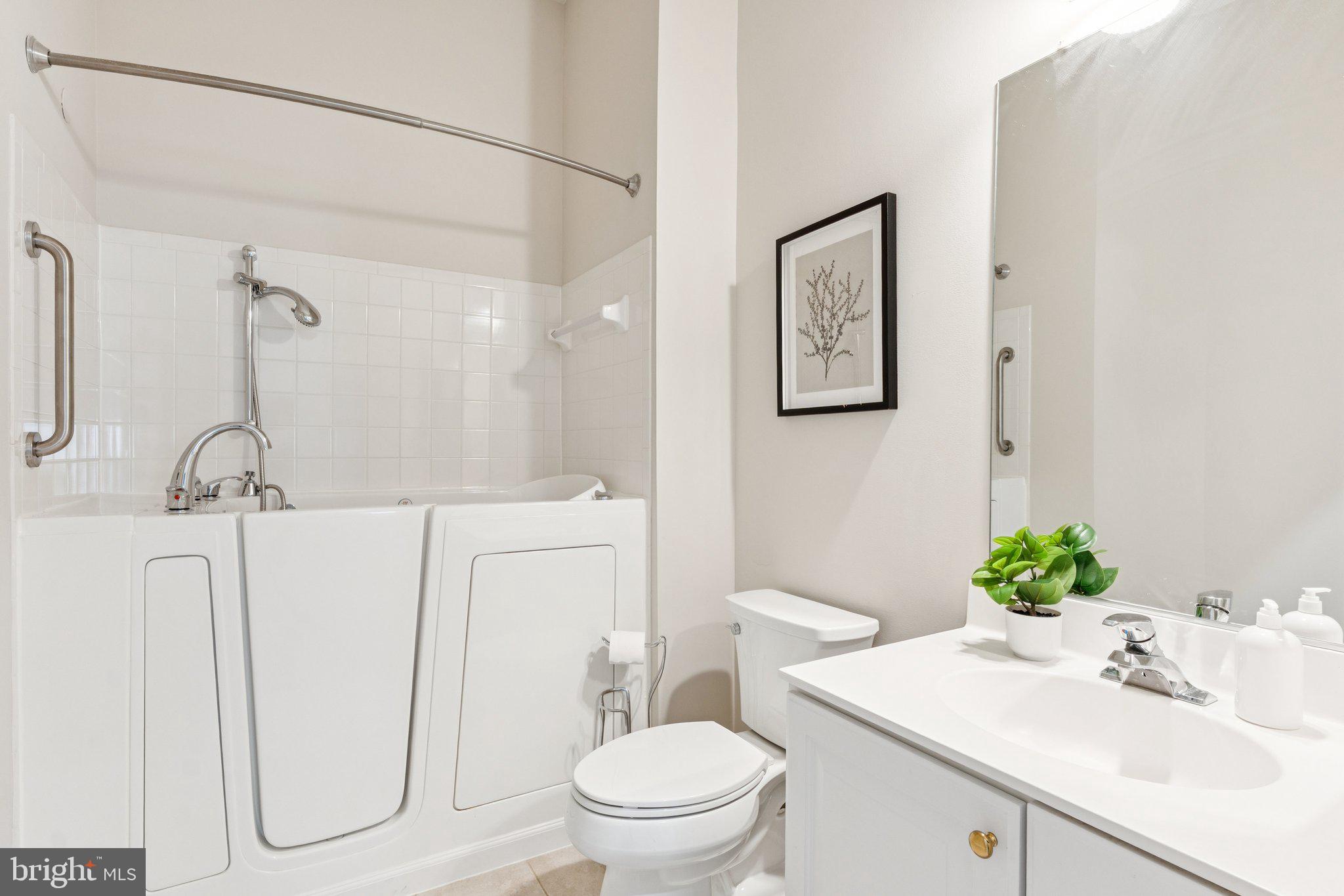 381 Colony Point Place Edgewater, MD 21037 - Photo 26 of 37 a bathroom with a sink toilet and shower