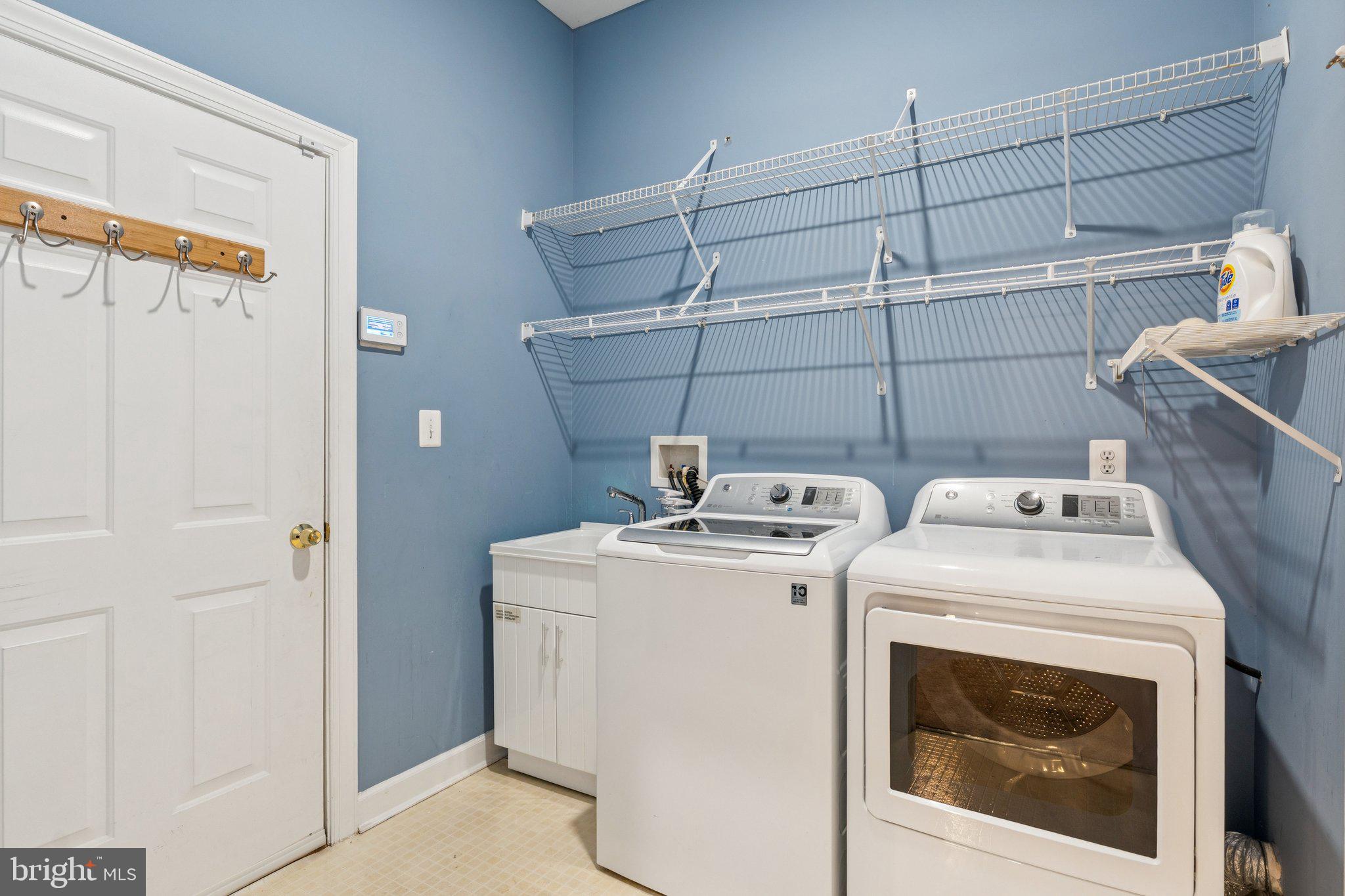 381 Colony Point Place Edgewater, MD 21037 - Photo 27 of 37 a utility room with dryer and washer