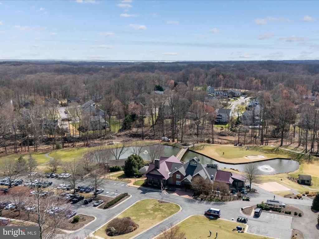 381 Colony Point Place Edgewater, MD 21037 - Photo 32 of 37 an aerial view of a house with swimming pool and lake view