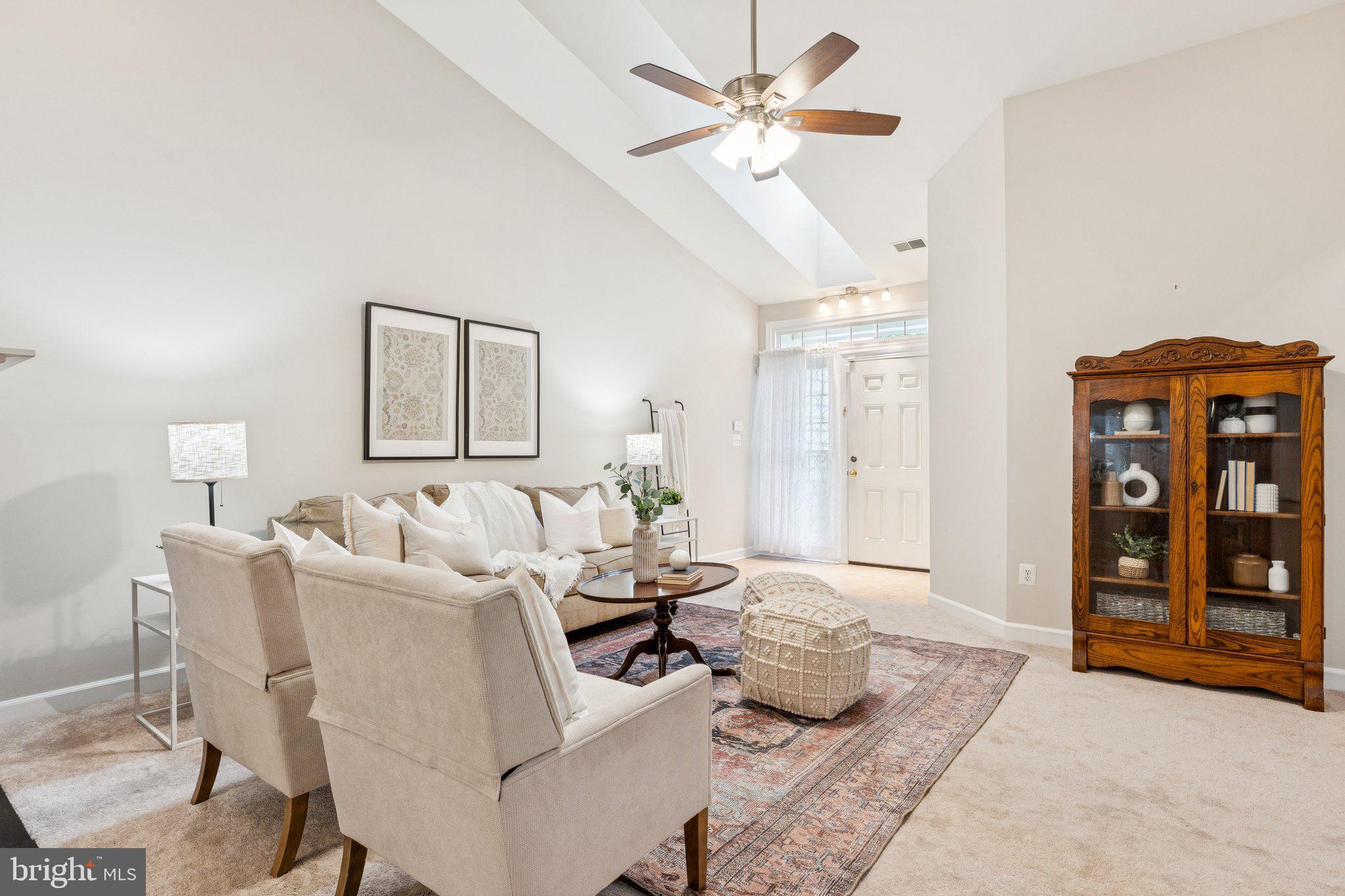 381 Colony Point Place Edgewater, MD 21037 - Photo 4 of 37 a living room with furniture two window and a chandelier