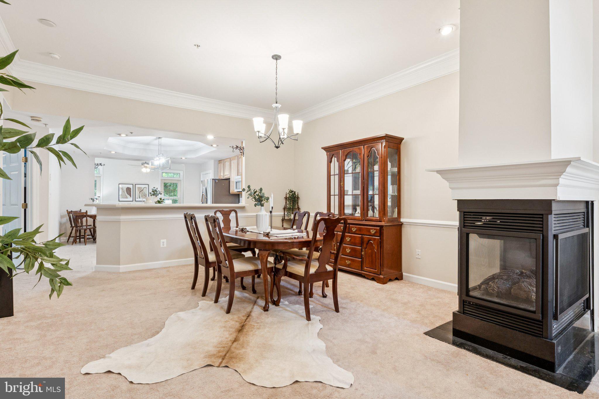 381 Colony Point Place Edgewater, MD 21037 - Photo 8 of 37 a dining room with furniture a livingroom and chandelier