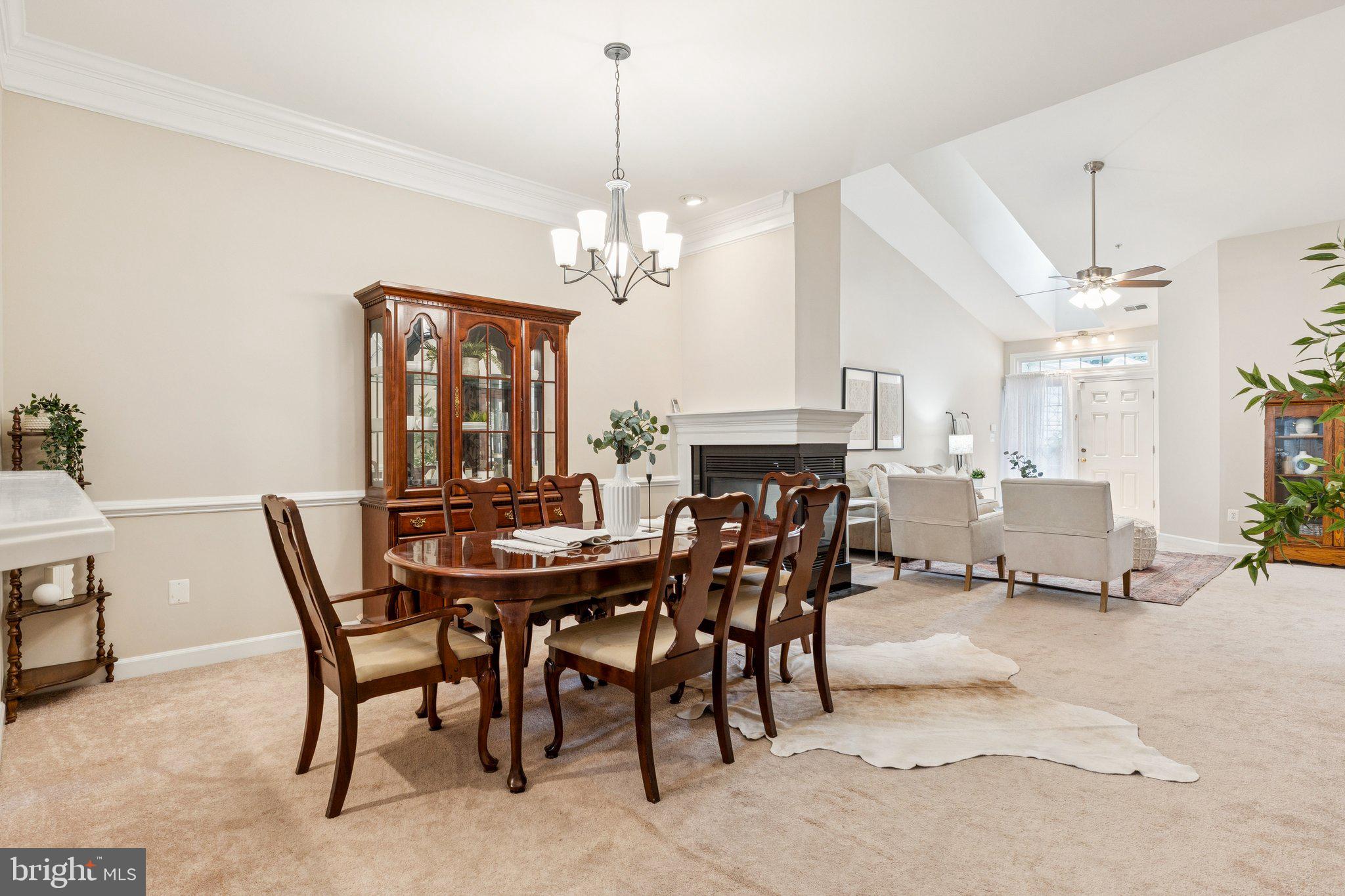 381 Colony Point Place Edgewater, MD 21037 - Photo 9 of 37 a view of a dining room with furniture and a chandelier