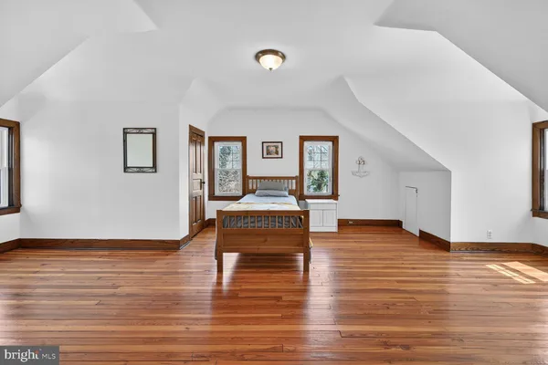 a bathroom with a sink mirror and window
