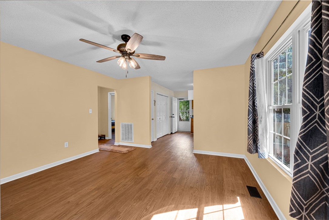 1020 Elizabeth Street Anderson, SC 29624 - Photo 5 of 22 A living space offers warm wood flooring and abundant natural light.