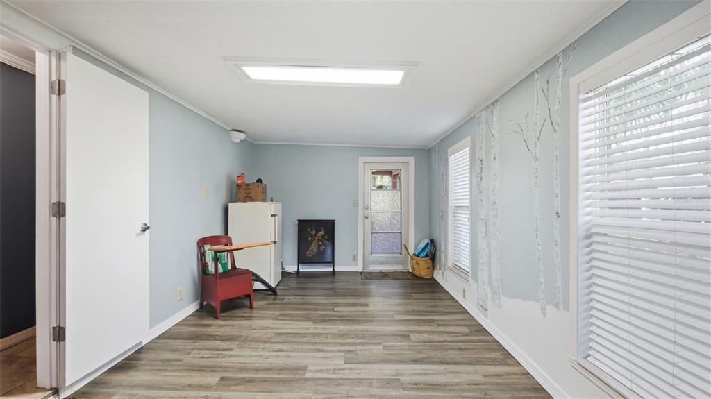 10565 Bessemer Street New Port Richey, FL 34654 - Photo 22 of 72 a view of a hallway with wooden floor and furniture