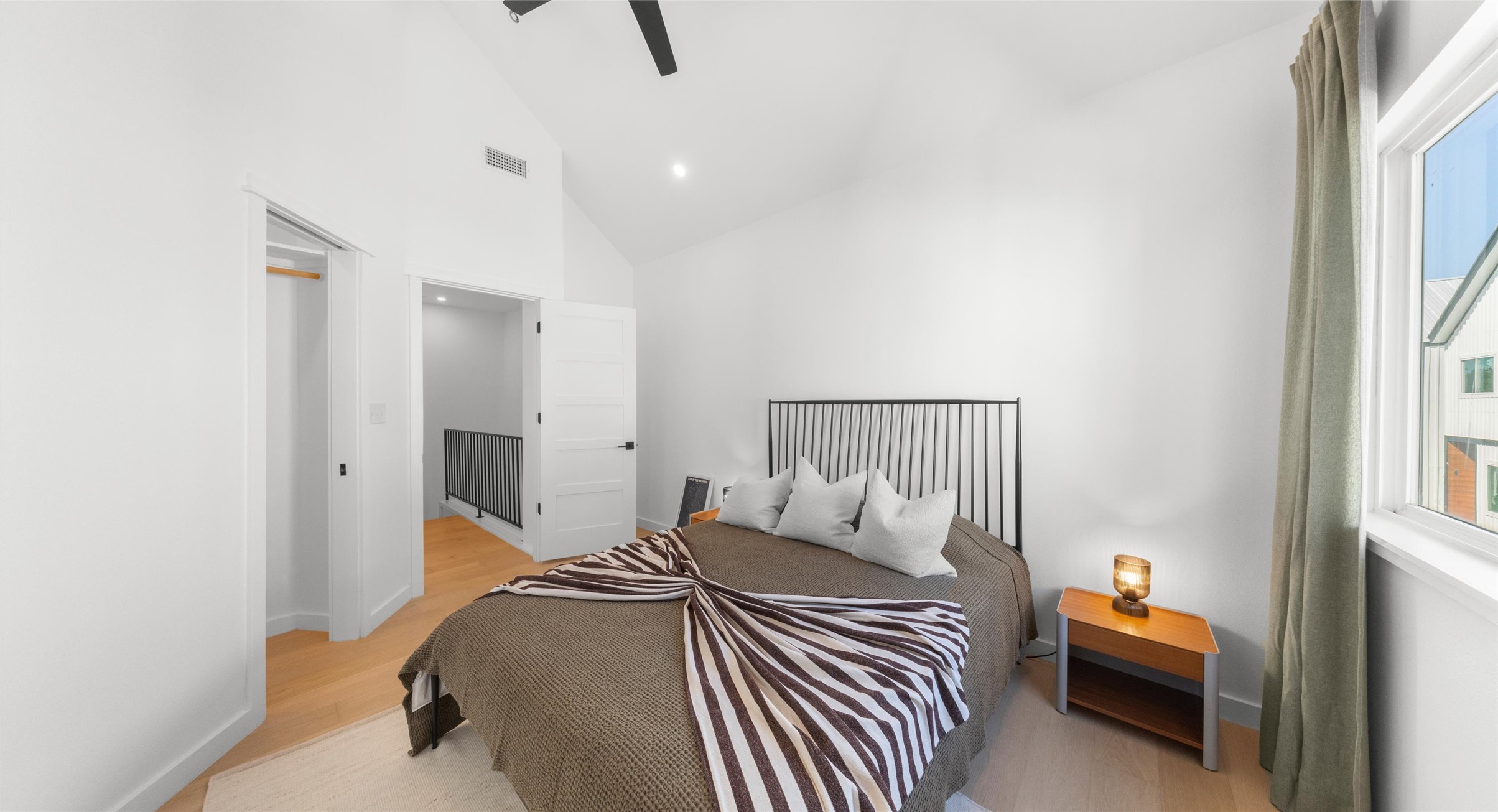 5912 Harold Court, Unit 107 Austin, TX 78721 - Photo 27 of 35 A peaceful secondary bedroom filled with natural light — a comfortable space for guests, a home office, or quiet downtime. Model No. 105 Shown.