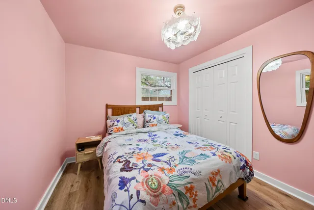 a bathroom with a granite countertop toilet sink and mirror