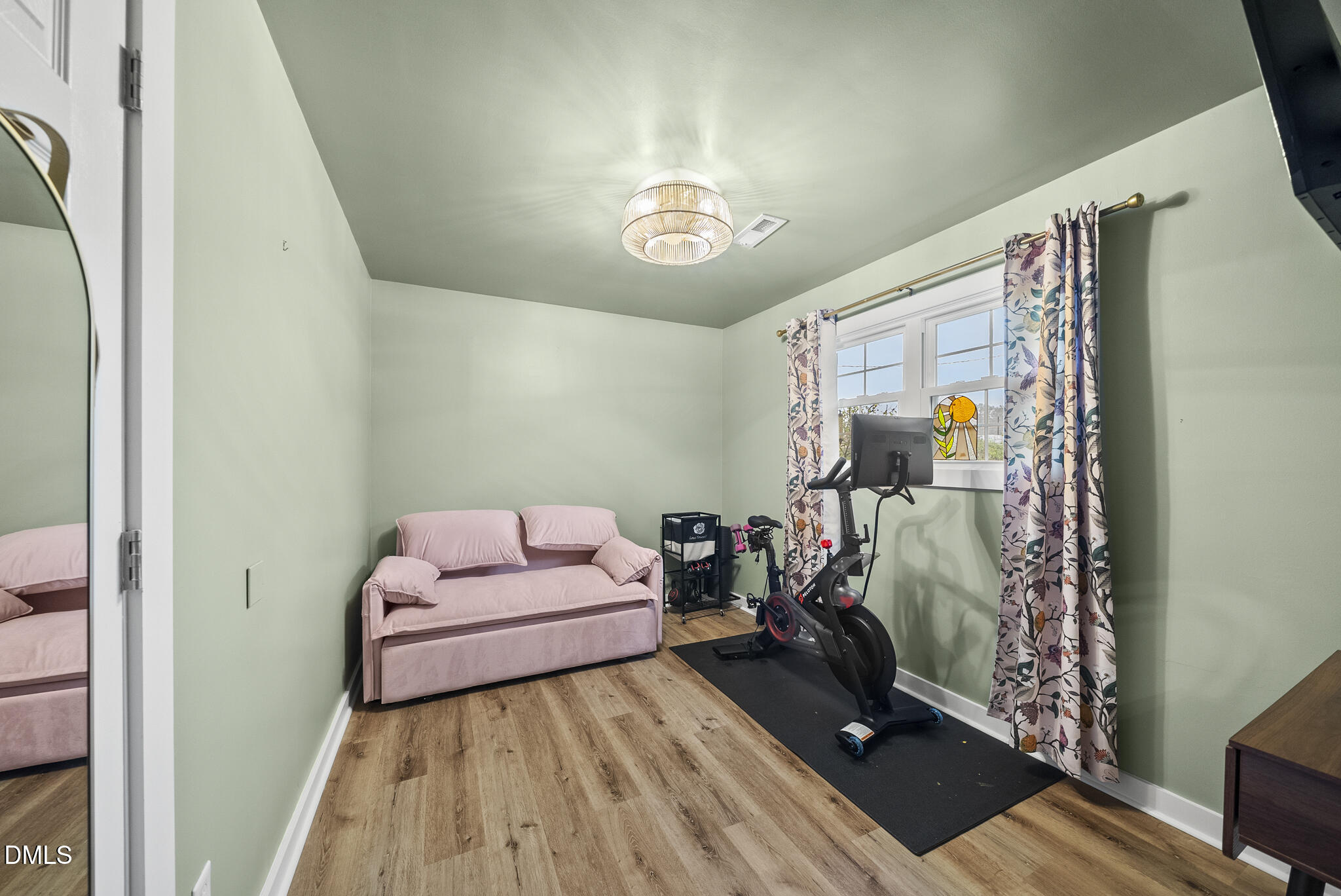 1002 Bacon Street Durham, NC 27701 - Photo 17 of 25 a bedroom with a bed and a window