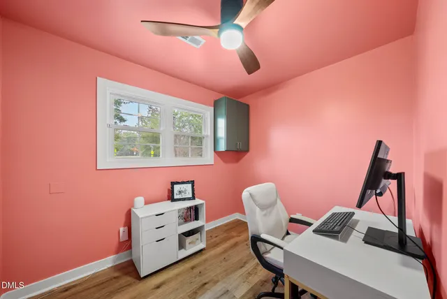 a workspace with furniture and wooden floor
