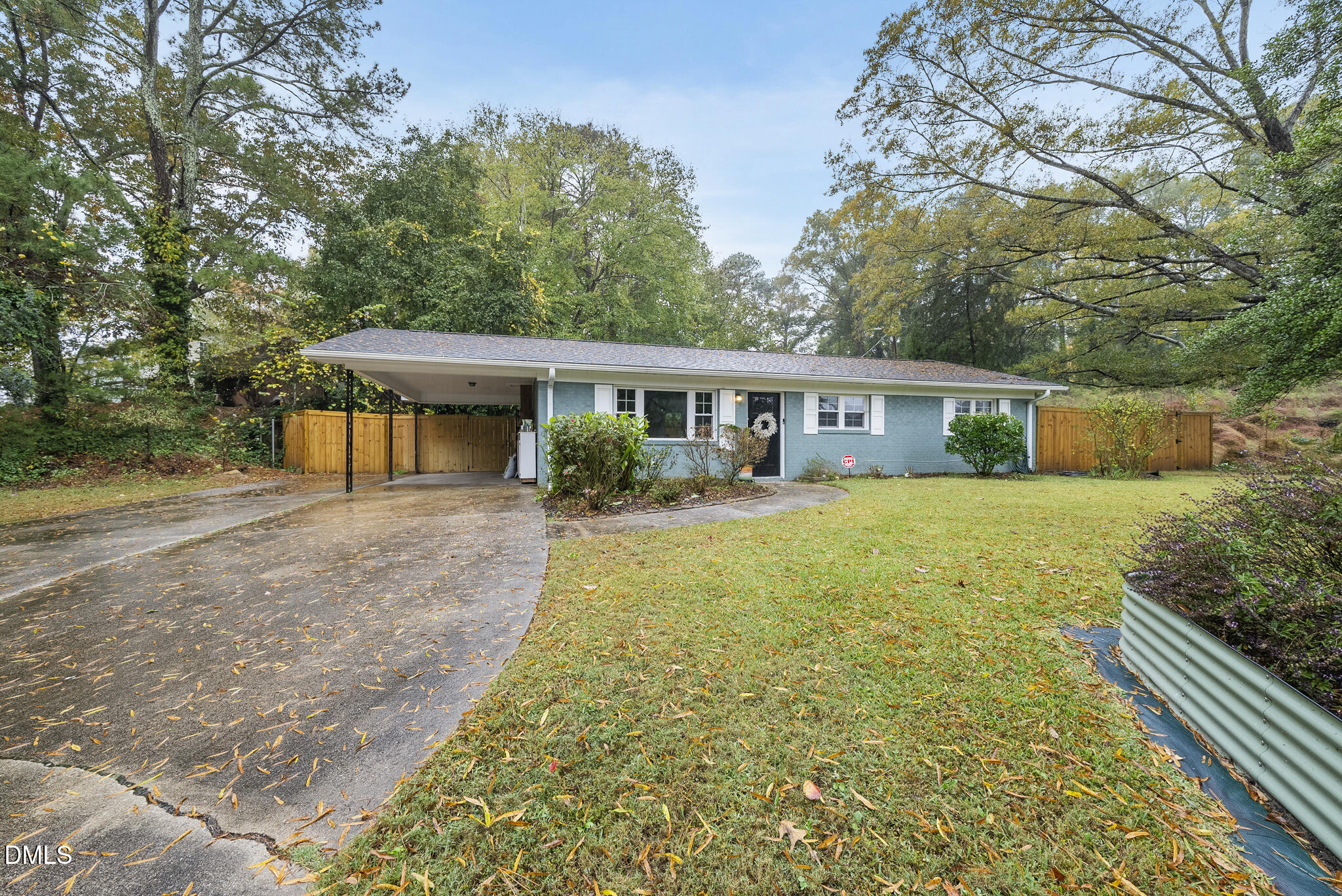 1002 Bacon Street Durham, NC 27701 - Photo 2 of 25 a view of a house with backyard and trees