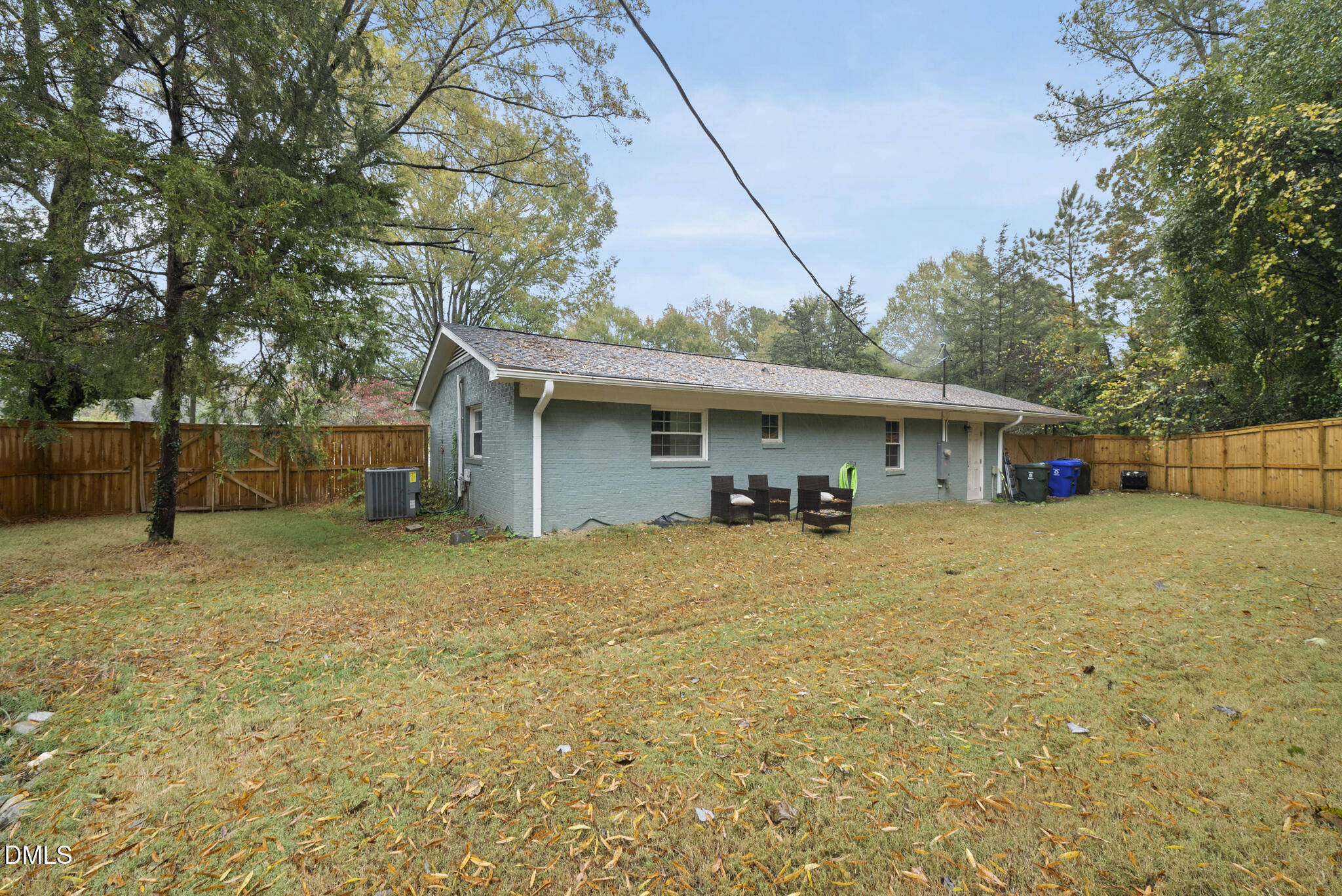 1002 Bacon Street Durham, NC 27701 - Photo 24 of 25 a view of a house with a barbeque and wooden stairs
