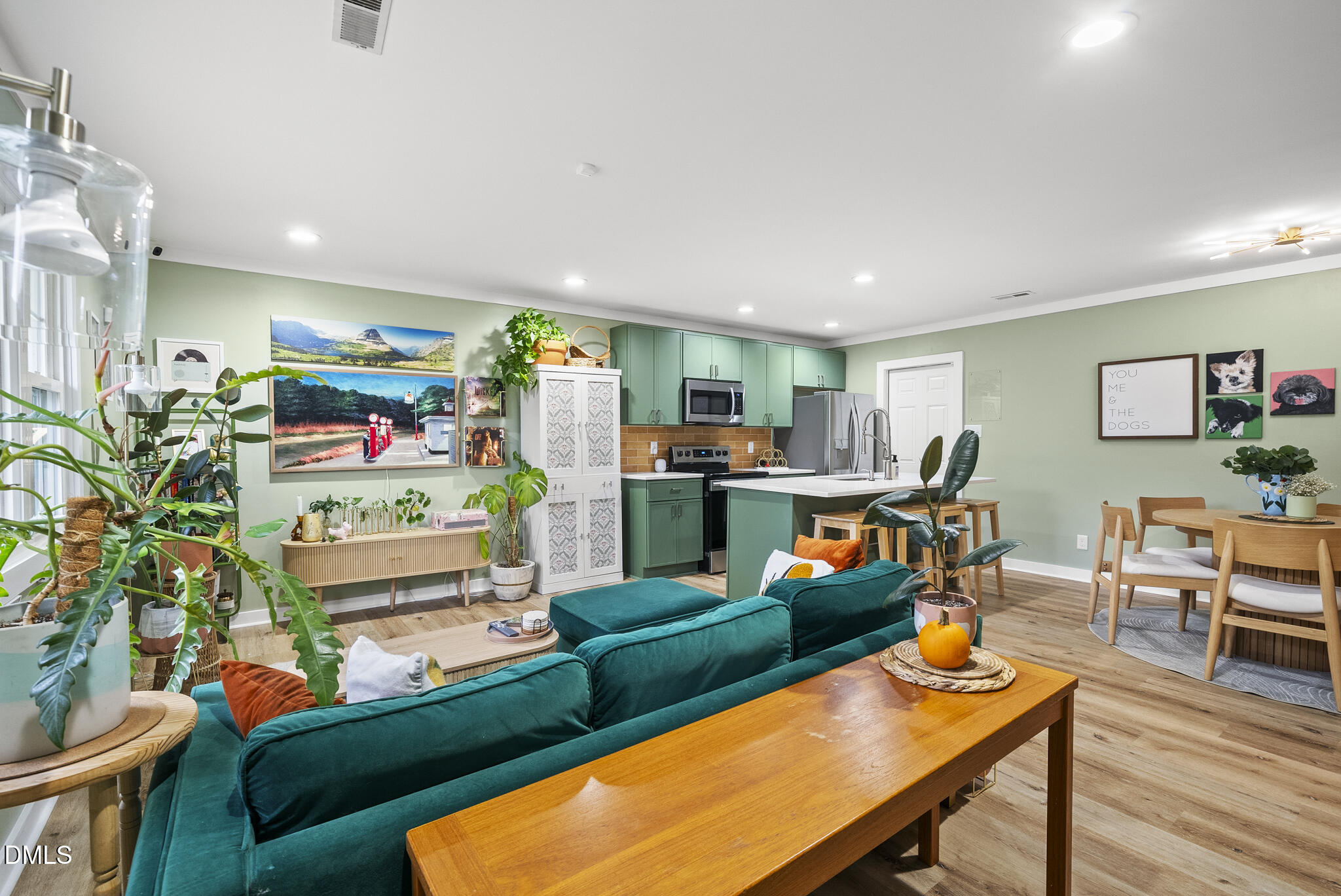 1002 Bacon Street Durham, NC 27701 - Photo 3 of 25 a living room filled with furniture and a wooden floor