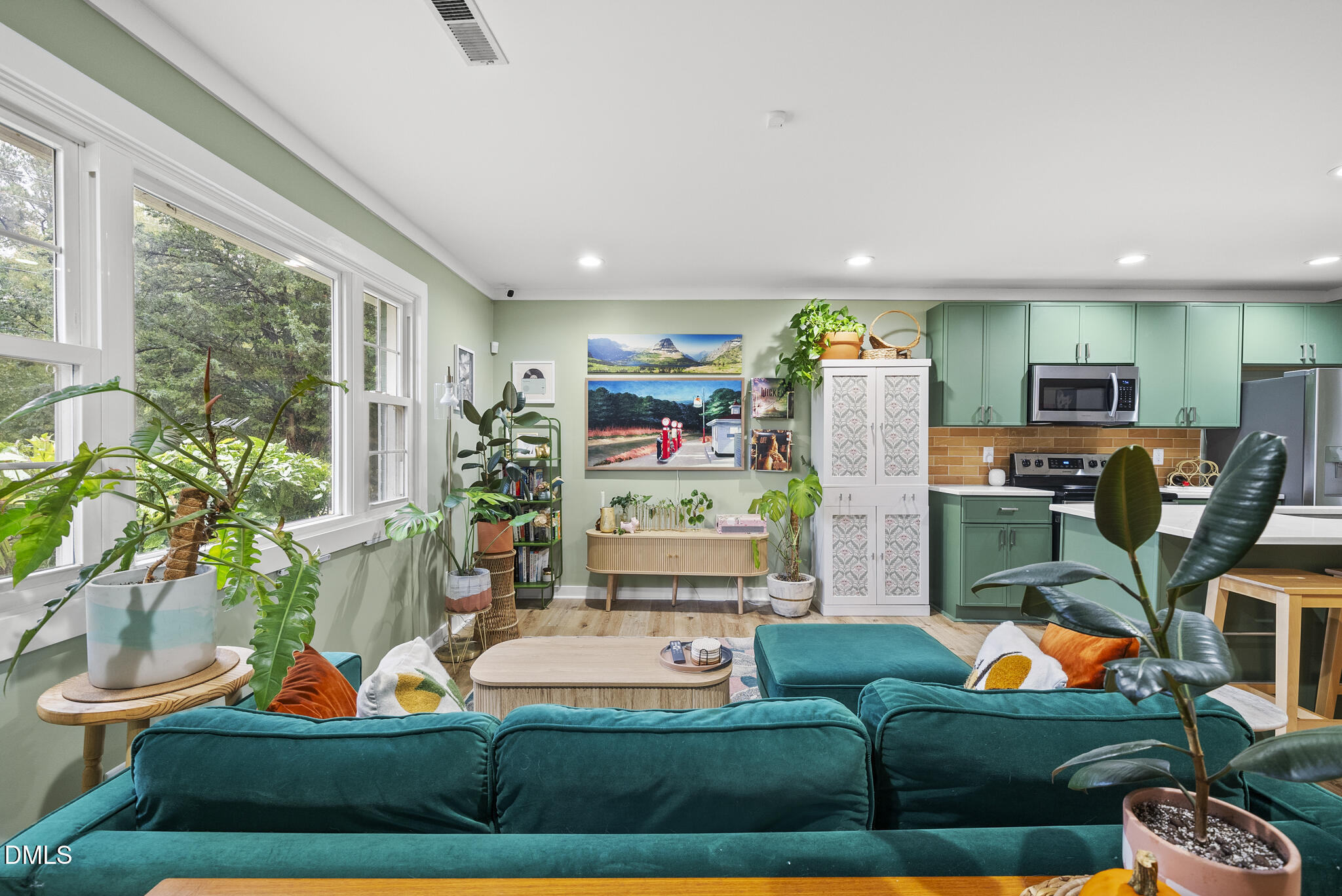 1002 Bacon Street Durham, NC 27701 - Photo 4 of 25 a living room with furniture a rug and a floor to ceiling window