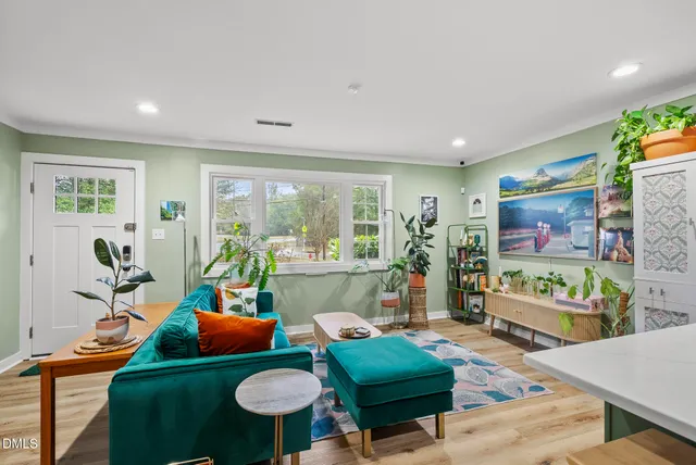 a living room with furniture and a flat screen tv