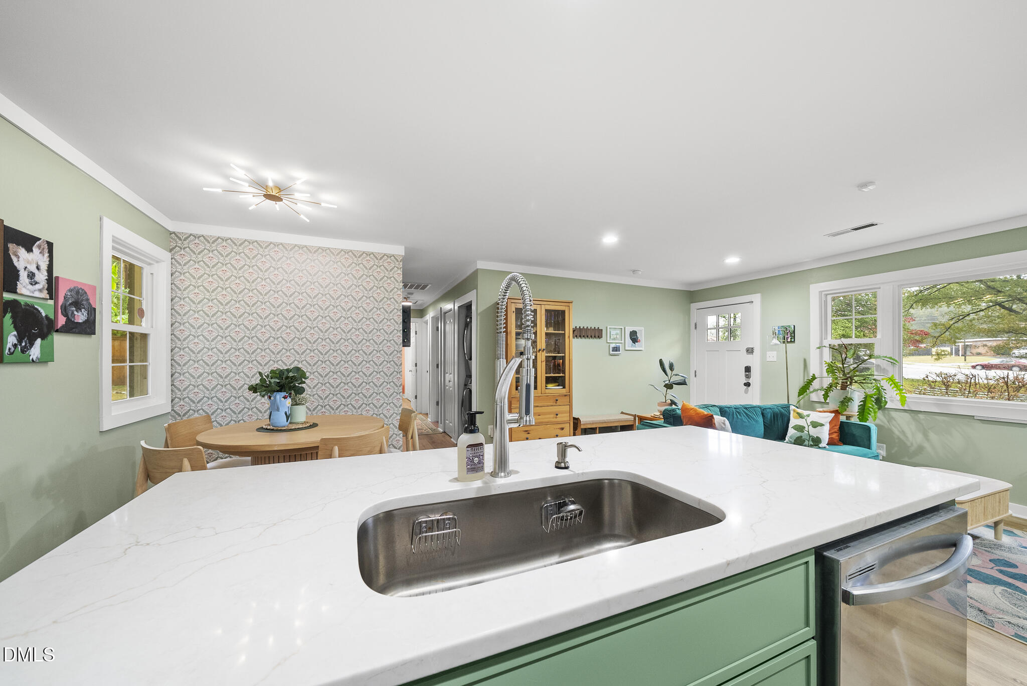 1002 Bacon Street Durham, NC 27701 - Photo 10 of 25 a kitchen with a sink a counter and chairs