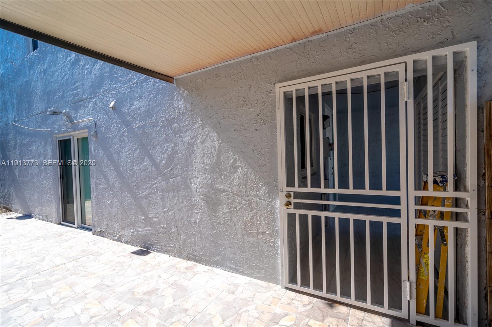 1070 West 43rd Place, Unit 38 Hialeah, FL 33012 - Photo 15 of 25 a view of wooden balcony