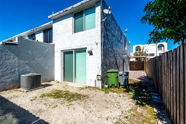 a backyard of a house with seating space