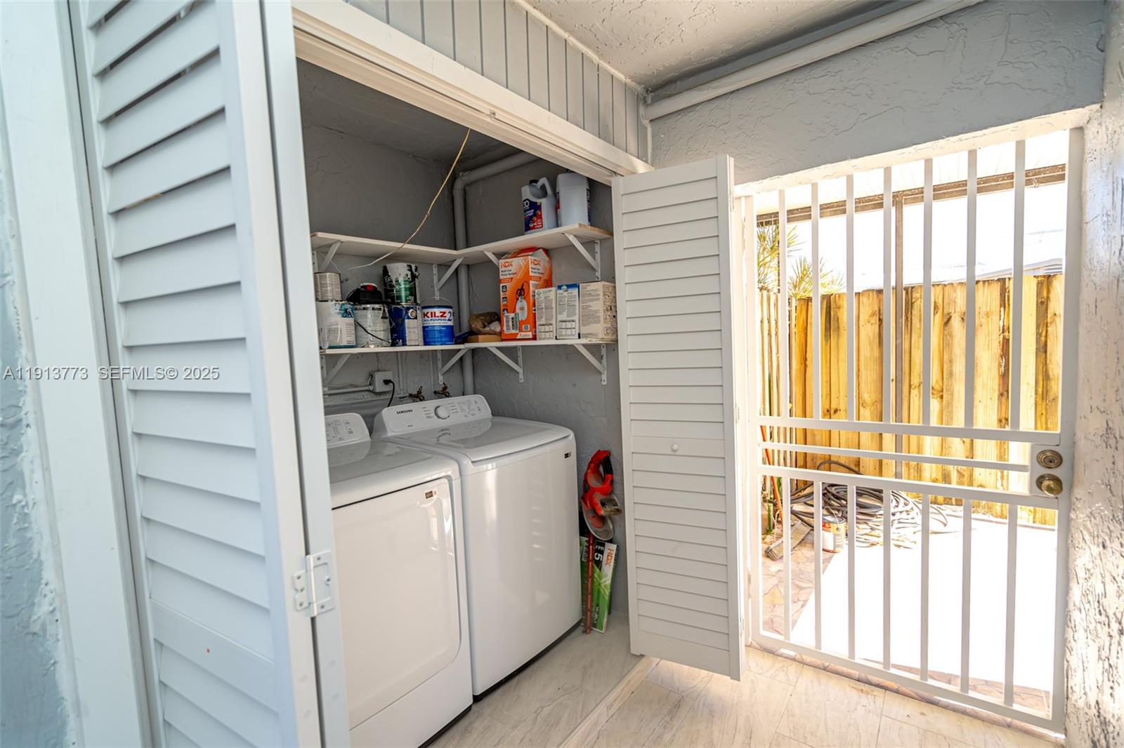 1070 West 43rd Place, Unit 38 Hialeah, FL 33012 - Photo 18 of 25 a utility room with dryer and washer