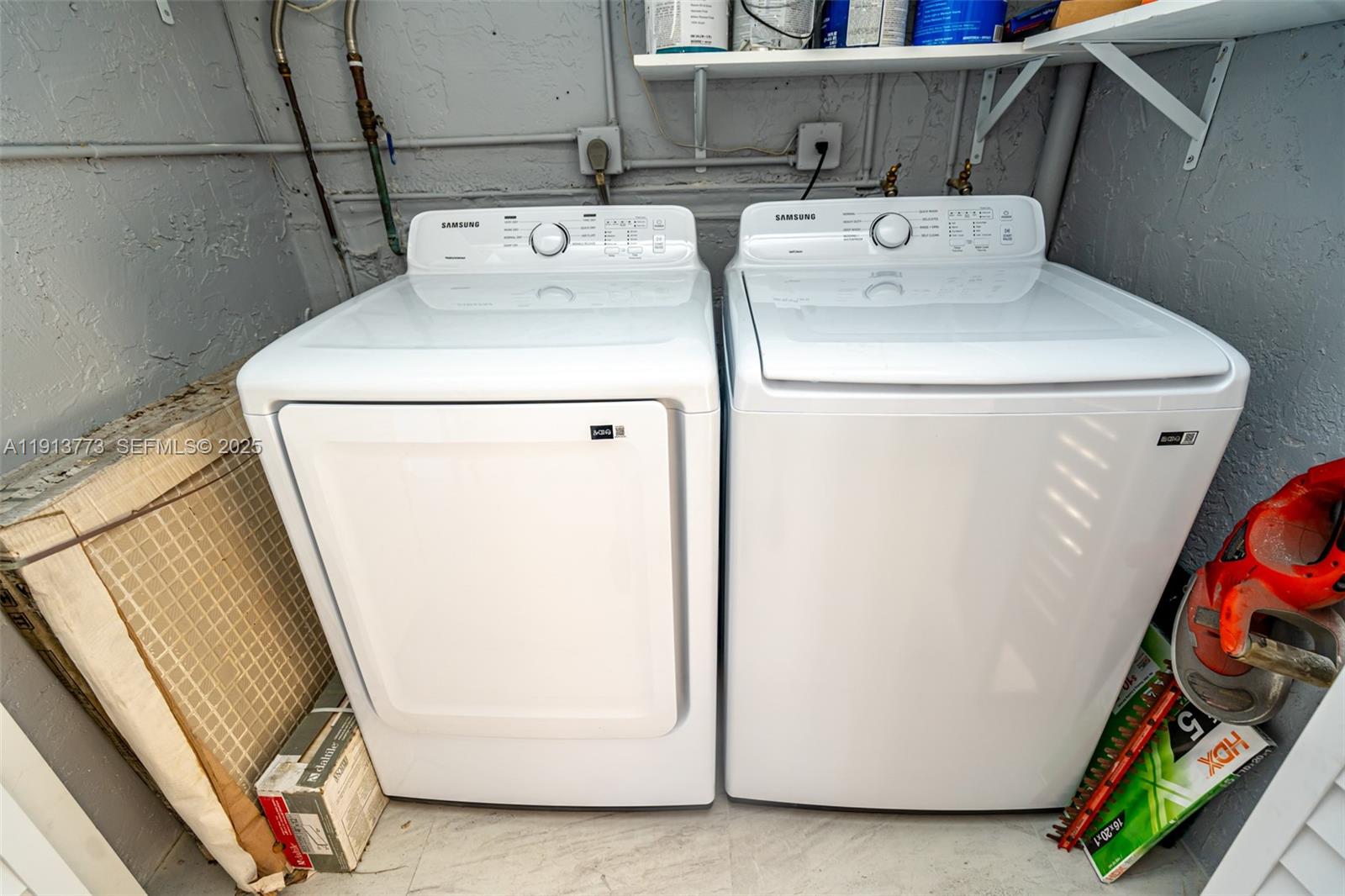 1070 West 43rd Place, Unit 38 Hialeah, FL 33012 - Photo 19 of 25 a utility room with dryer and washer