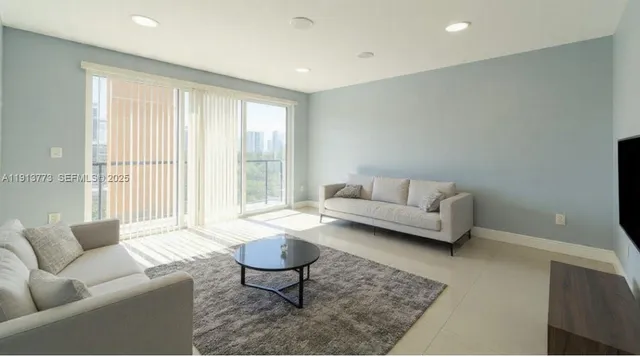 a living room with furniture and a rug