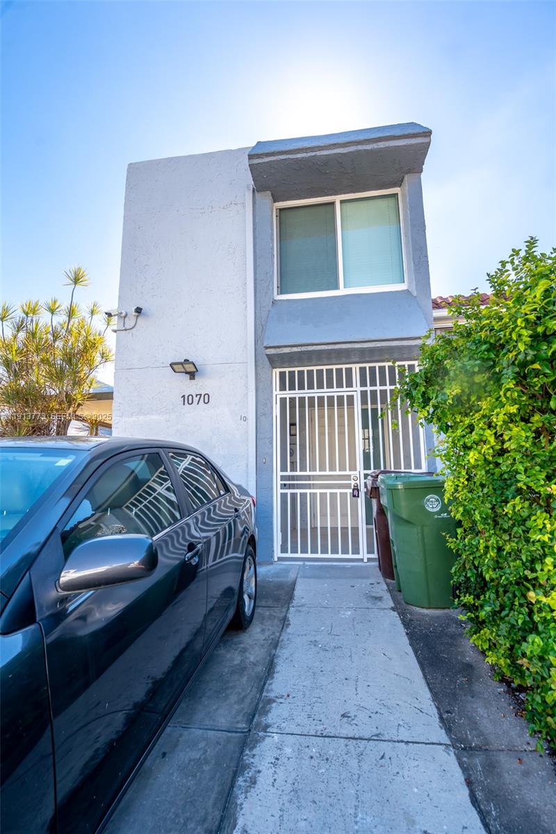 1070 West 43rd Place, Unit 38 Hialeah, FL 33012 - Photo 21 of 25 a bedroom with a bed and a window