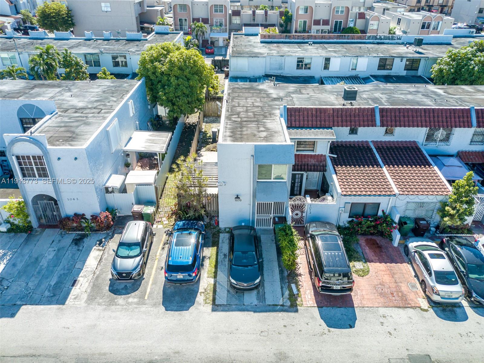 1070 West 43rd Place, Unit 38 Hialeah, FL 33012 - Photo 23 of 25 an aerial view of a house with garden space and seating area