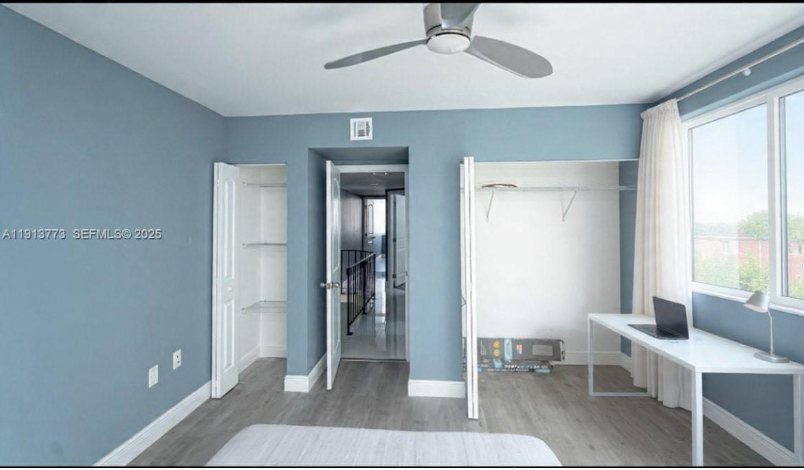 1070 West 43rd Place, Unit 38 Hialeah, FL 33012 - Photo 3 of 25 a living room with furniture a window and a ceiling fan