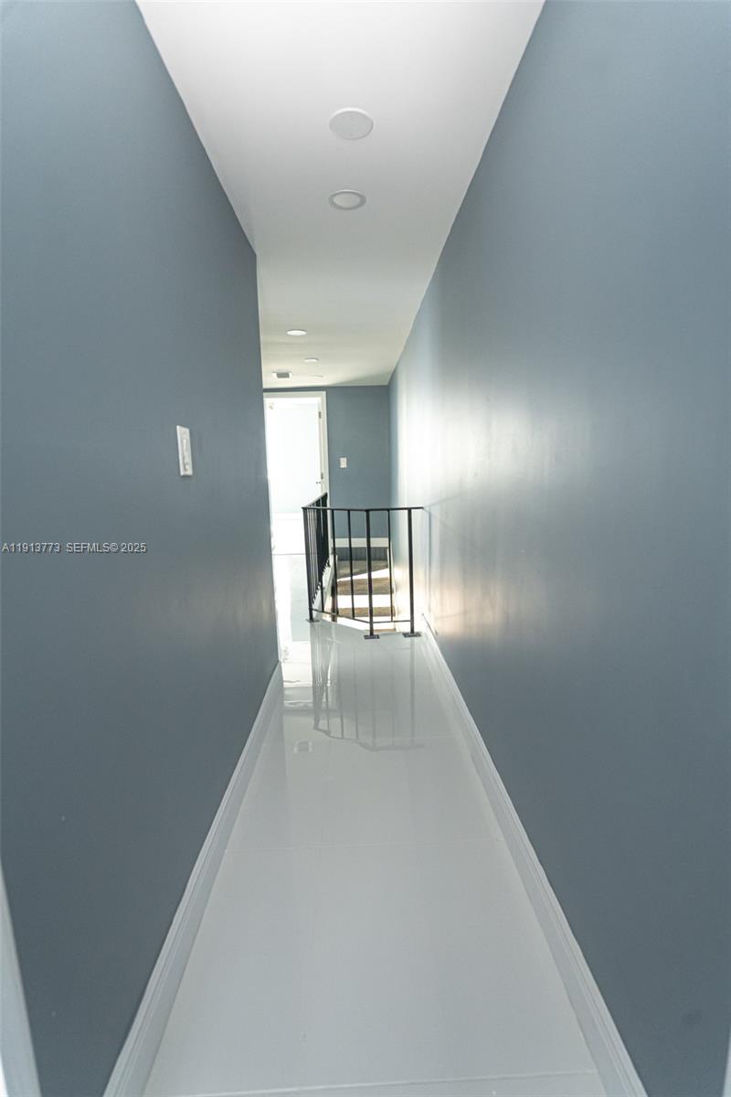 1070 West 43rd Place, Unit 38 Hialeah, FL 33012 - Photo 4 of 25 a view of a hallway