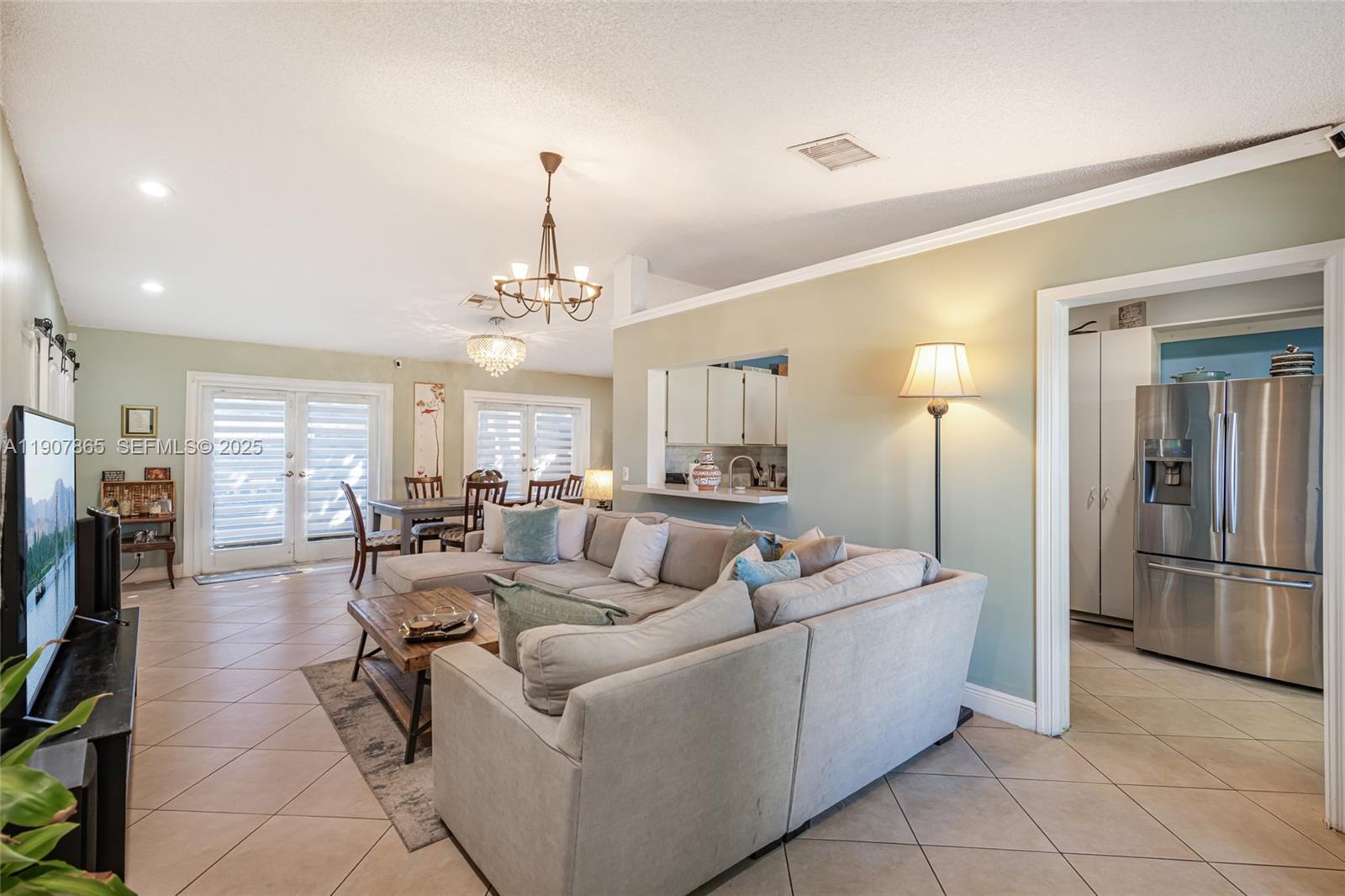 5830 North Park Road Dania Beach, FL 33312 - Photo 16 of 31 a living room with furniture a dining table and chairs