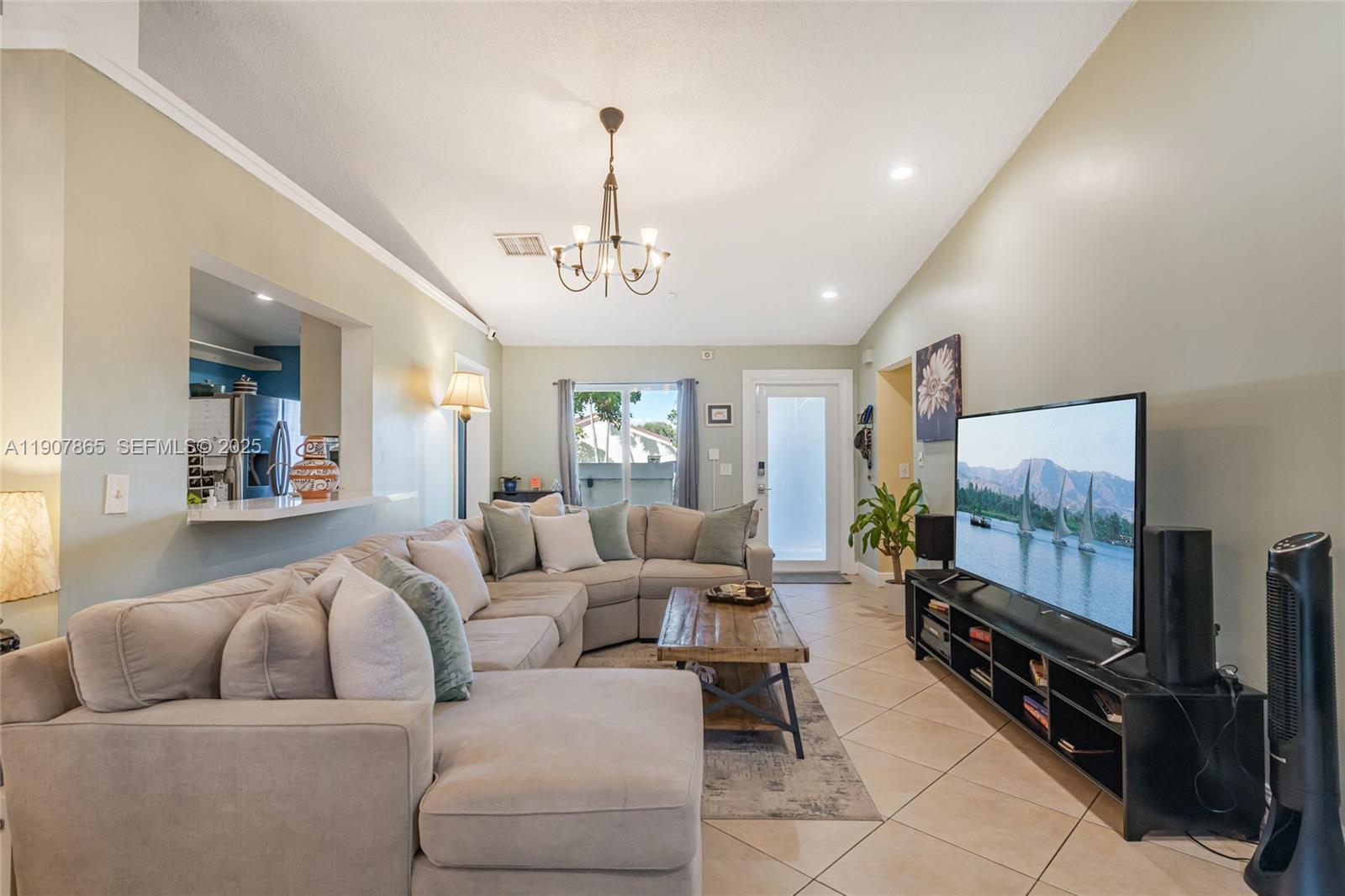 5830 North Park Road Dania Beach, FL 33312 - Photo 17 of 31 a living room with furniture and a flat screen tv