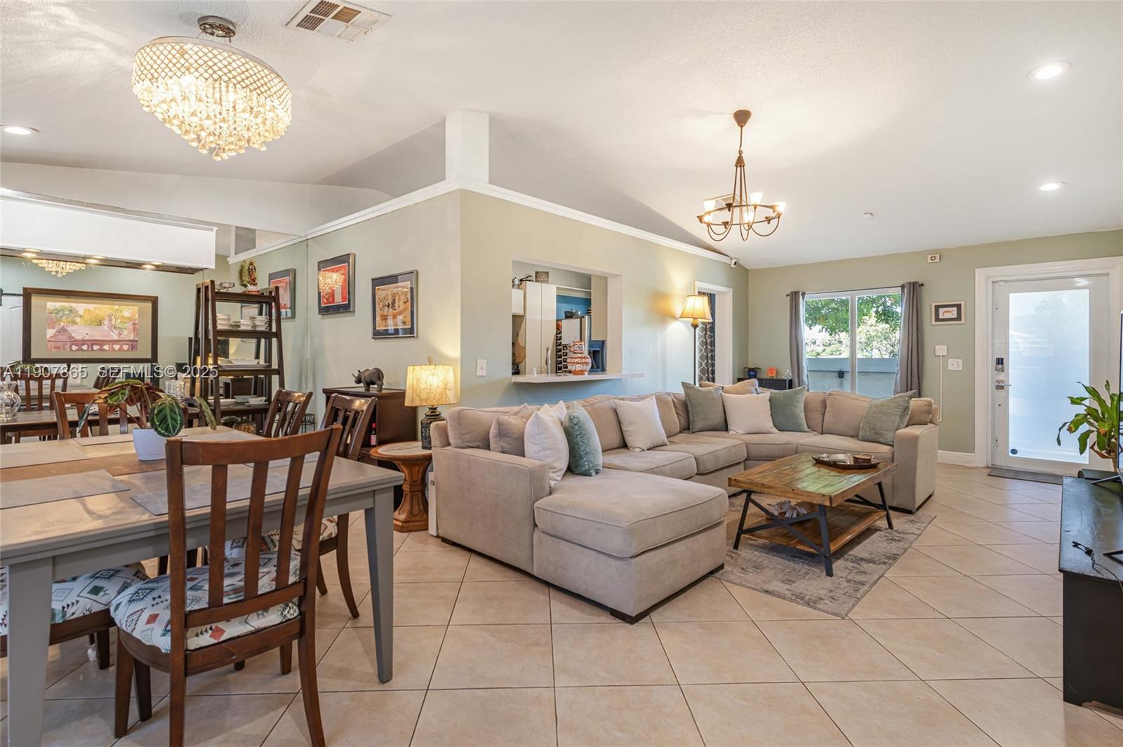 5830 North Park Road Dania Beach, FL 33312 - Photo 18 of 31 a living room with furniture chandelier and a view of kitchen