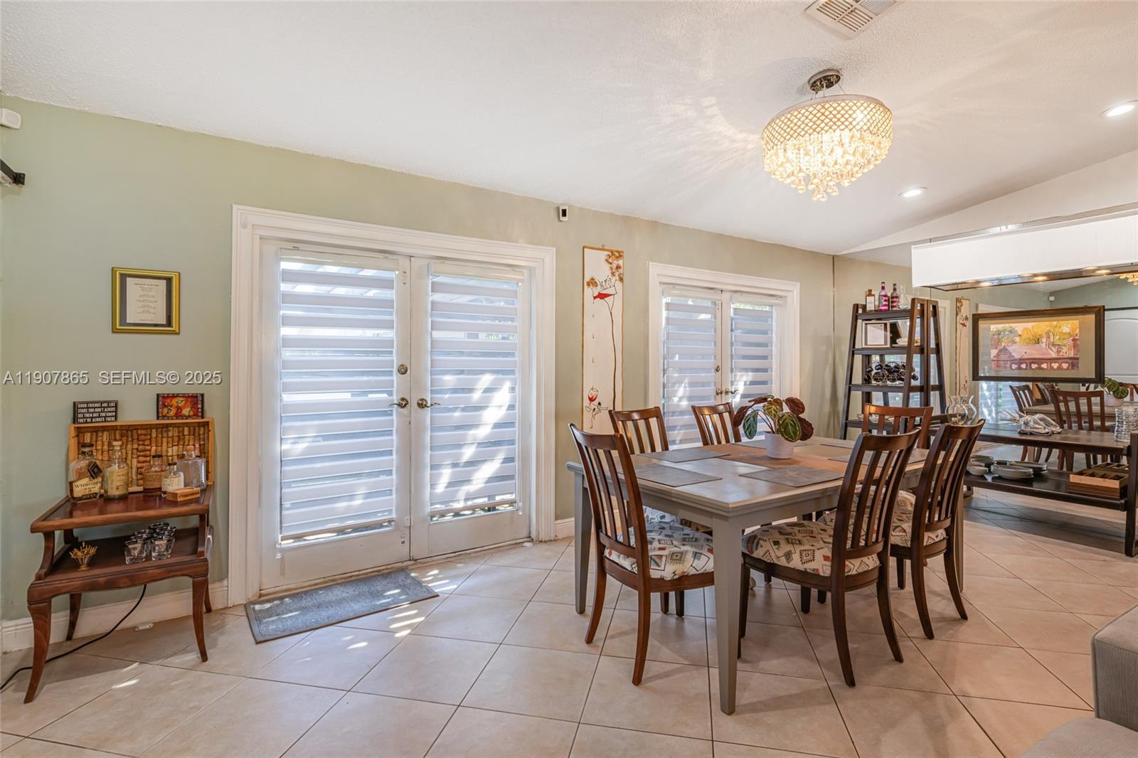 5830 North Park Road Dania Beach, FL 33312 - Photo 19 of 31 a view of a dining room with furniture and chandelier