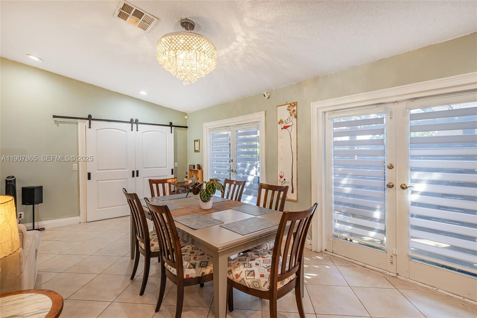 5830 North Park Road Dania Beach, FL 33312 - Photo 20 of 31 a view of a dining room with furniture and chandelier