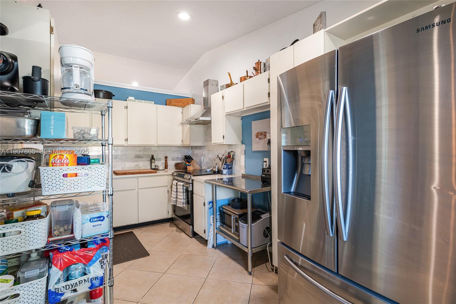 5830 North Park Road Dania Beach, FL 33312 - Photo 21 of 31 a kitchen with refrigerator and cabinets