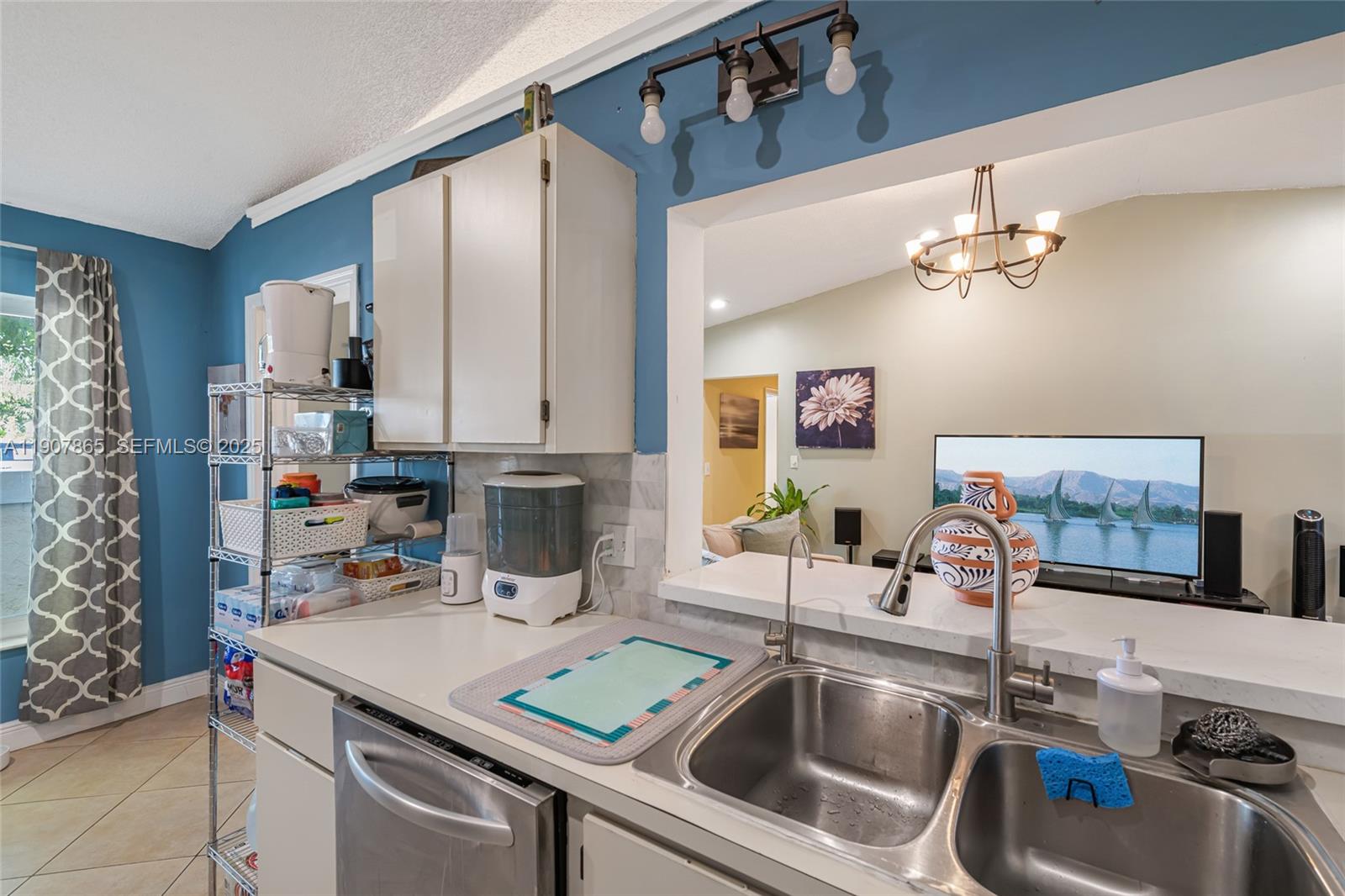 5830 North Park Road Dania Beach, FL 33312 - Photo 23 of 31 a kitchen with a sink a stove and a refrigerator with wooden floor