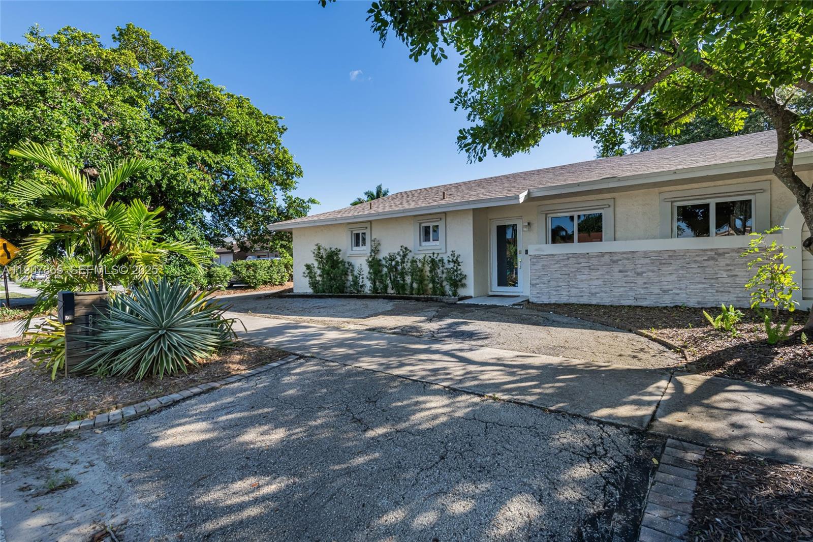 5830 North Park Road Dania Beach, FL 33312 - Photo 4 of 31 a front view of a house with garden