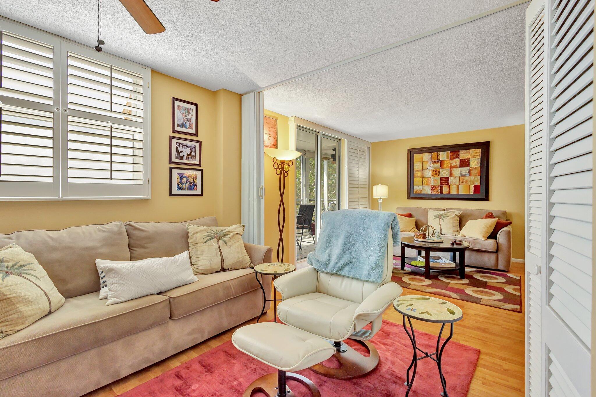 6461 Northwest 2nd Avenue, Unit 512 Boca Raton, FL 33487 - Photo 11 of 22 a living room with furniture and a large window