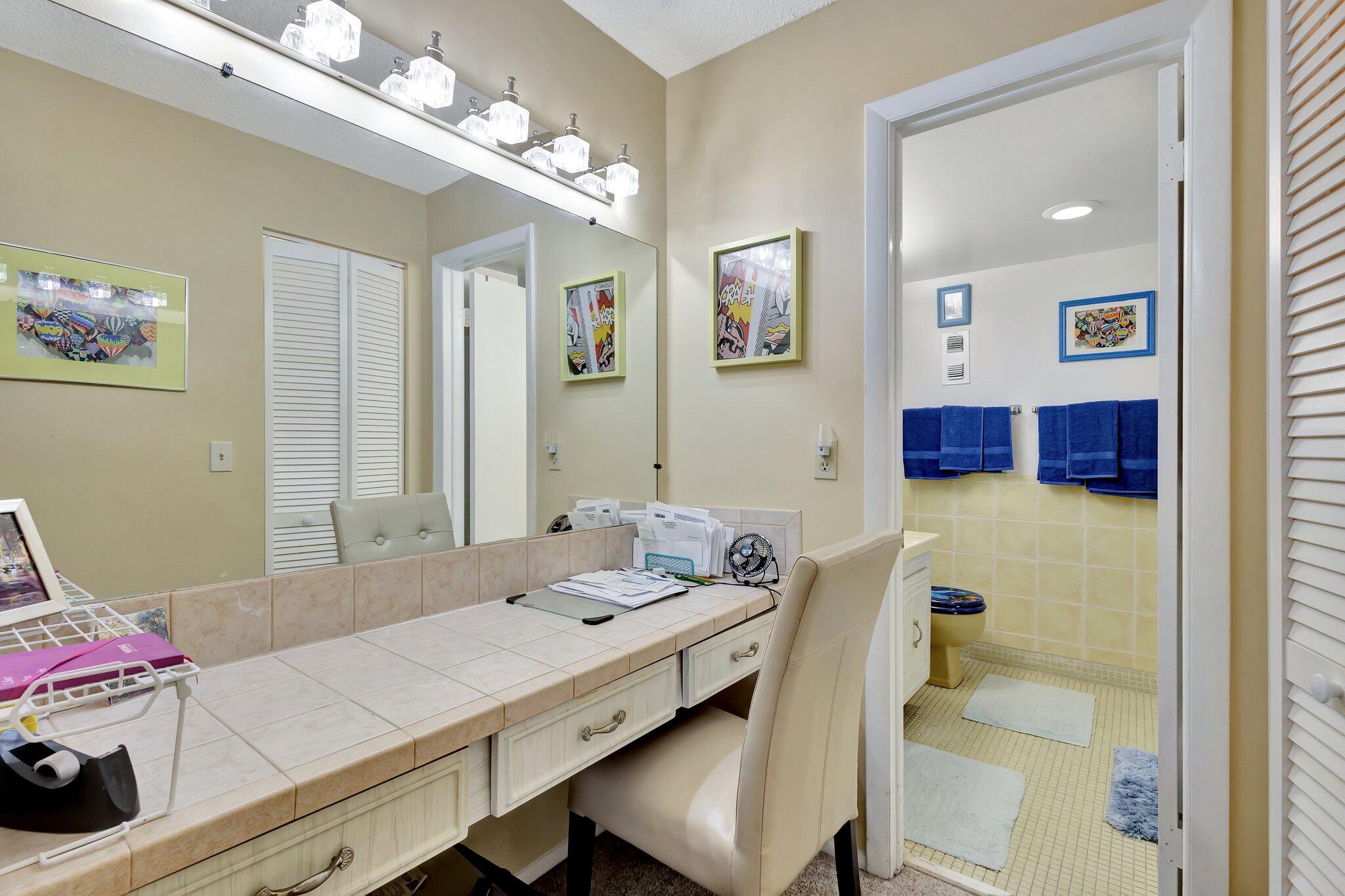 6461 Northwest 2nd Avenue, Unit 512 Boca Raton, FL 33487 - Photo 17 of 22 a bath room with a bed and a table