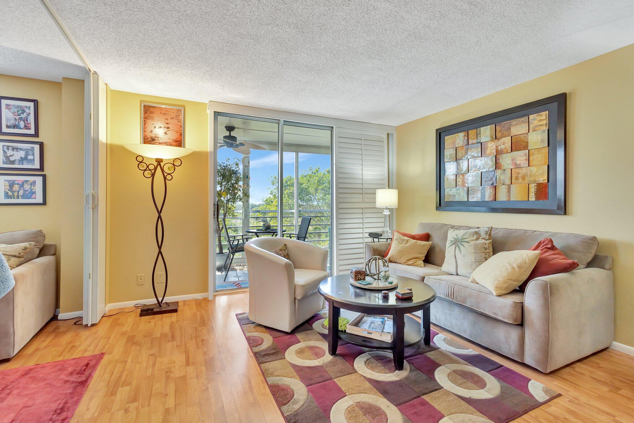 6461 Northwest 2nd Avenue, Unit 512 Boca Raton, FL 33487 - Photo 5 of 22 a living room with furniture and large window