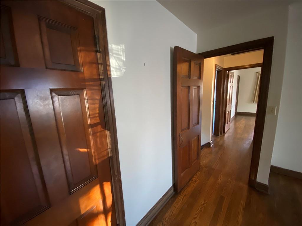 5659 Darlington Road Pittsburgh, PA 15217 - Photo 11 of 23 a view of a hallway with wooden floor and glass door