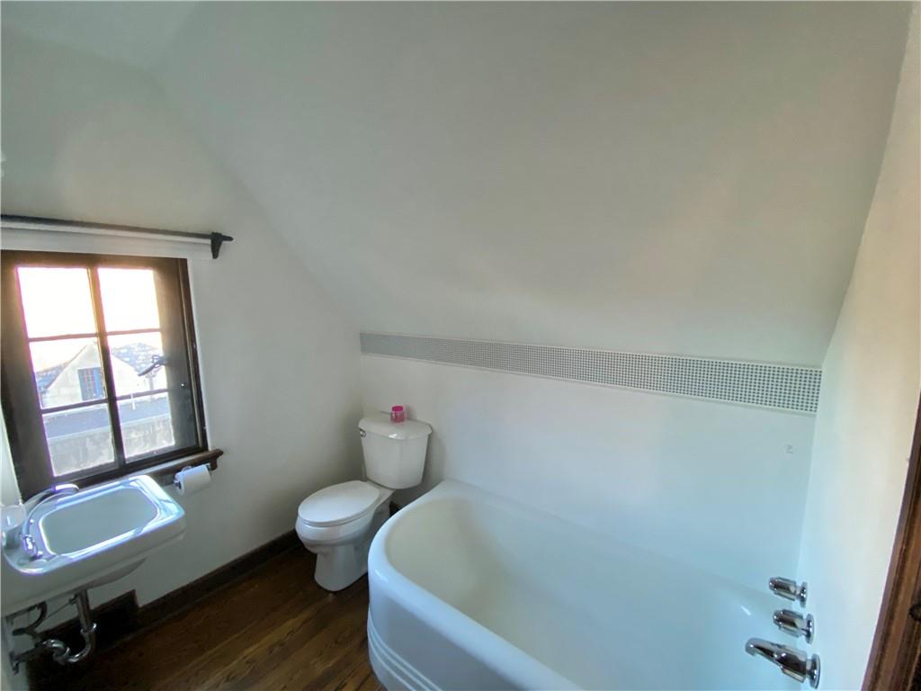 5659 Darlington Road Pittsburgh, PA 15217 - Photo 20 of 23 a white bath tub sitting next to a toilet