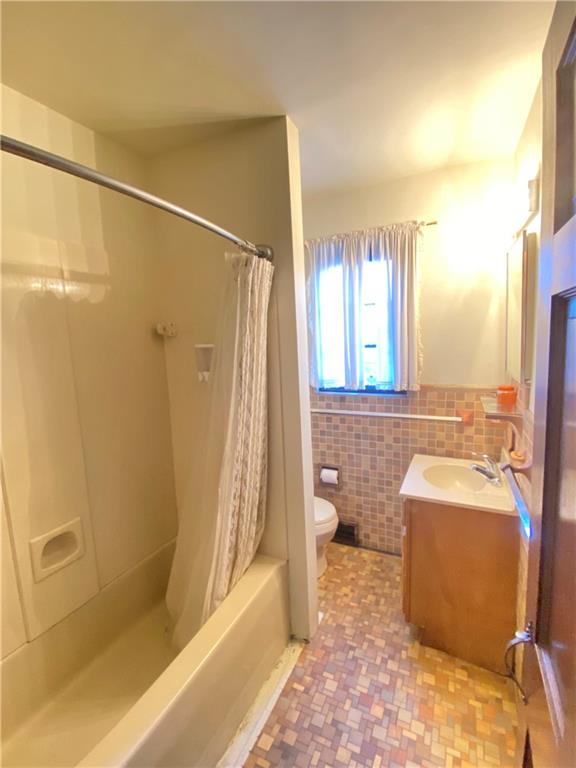 5659 Darlington Road Pittsburgh, PA 15217 - Photo 21 of 23 a bathroom with a granite countertop sink a toilet and shower