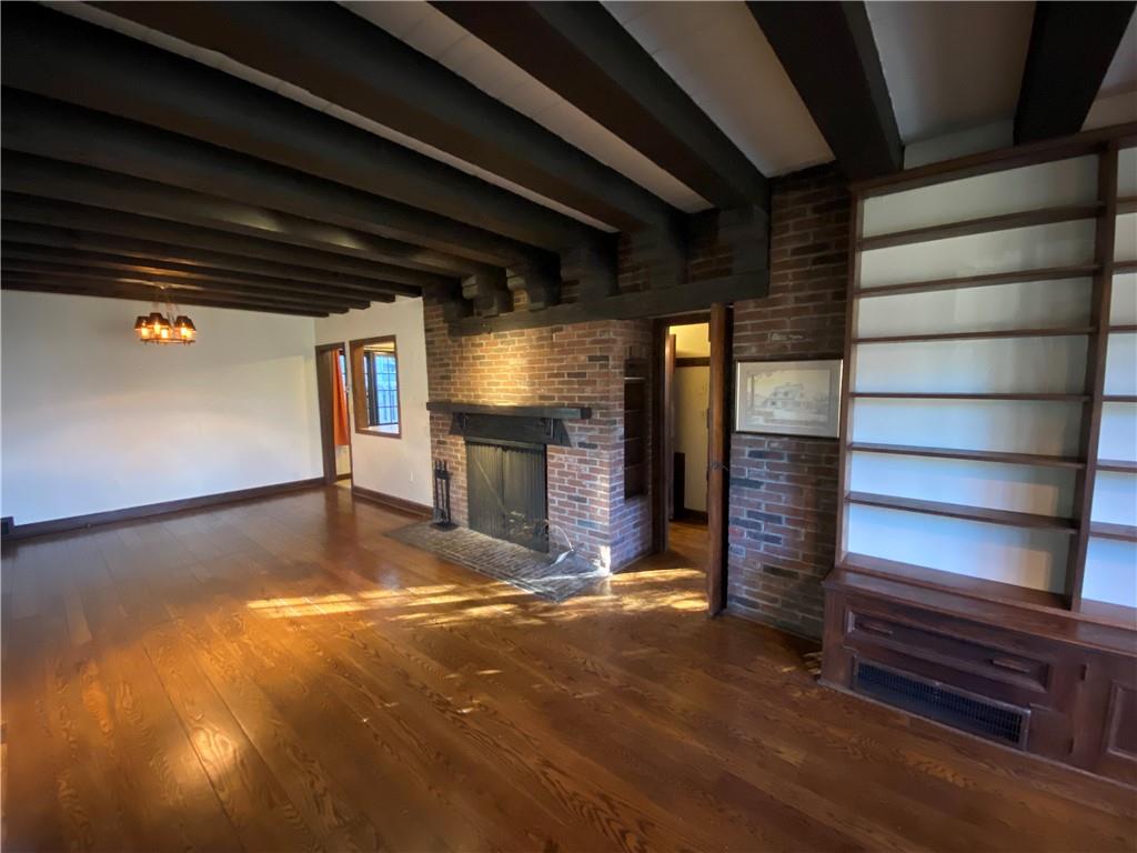 5659 Darlington Road Pittsburgh, PA 15217 - Photo 3 of 23 a view of water heater room with wooden floor
