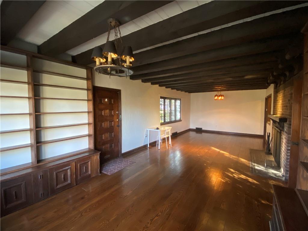 5659 Darlington Road Pittsburgh, PA 15217 - Photo 6 of 23 a view of a livingroom with wooden floor a ceiling fan and windows