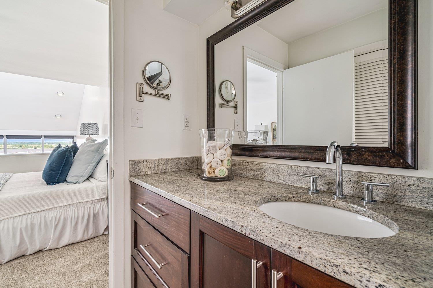 335 Riverbluff Place, Unit 3 Memphis, TN 38103 - Photo 11 of 17 a bathroom with a granite countertop sink and a mirror