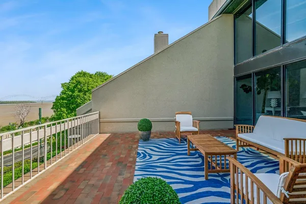 a view of a chairs and table on the deck