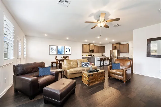 a kitchen with stainless steel appliances a microwave sink and refrigerator
