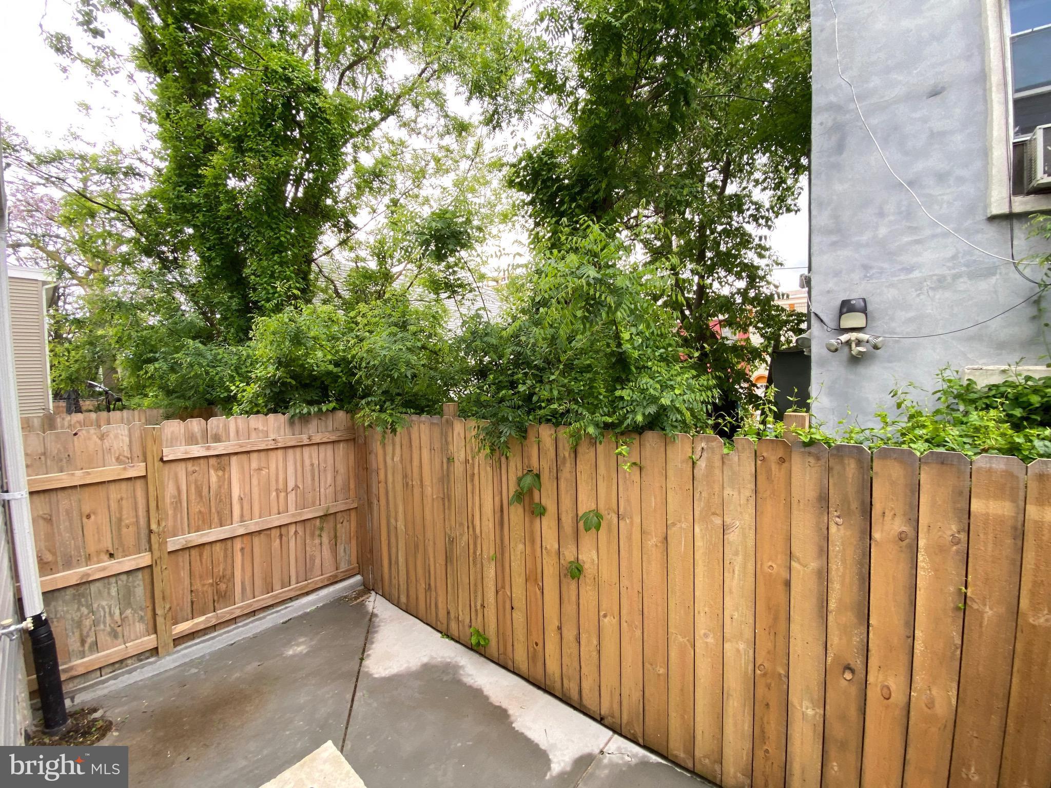 1932 North 8th Street, Unit 1 Philadelphia, PA 19122 - Photo 11 of 12 a view of a wooden fence